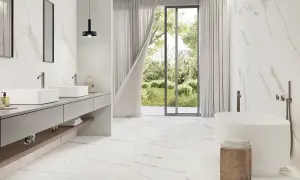 A modern bathroom with Carrara marble tiles. The best grout color for Carrara marble is subtle, allowing the natural veining to shine.
