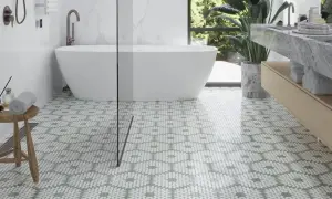 Stylish bathroom with a freestanding tub and a patterned floor. Pictures of shower floors like this one showcase a modern design.
