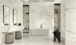 Luxurious bathroom with marble-look tiles featuring thin grout lines vs thick. A freestanding tub, double vanity, and modern stools create a spa-like atmosphere.