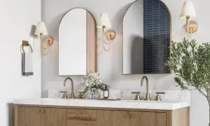 A modern double vanity with marble countertop, brass fixtures, and arched mirrors. The image hints at ideal double vanity dimensions for a spacious bathroom.