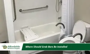 Bathroom with grab bar installation for safety. A bathtub with a transfer bench and a toilet with a raised seat are visible.