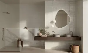 Modern bathroom featuring large format neutral tiles and textured subway tiles, showcasing diverse types of tile for bathroom design.
