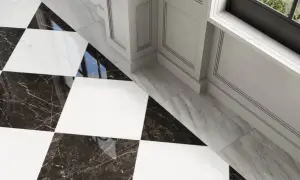 A striking black and white checkerboard tile floor with marble accents. The question of what color grout for black and white checkerboard tile is answered by the subtle, almost invisible grout lines, enhancing the bold pattern.