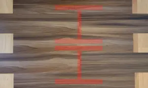 Visual guide on how to install vinyl plank flooring, showing a pattern of wood-look planks with a red overlay indicating installation steps.