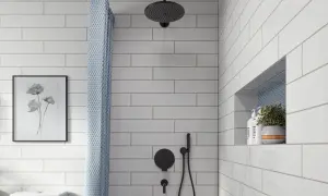 A modern bathroom features white subway tile with light gray grout, a black showerhead, and a patterned shower curtain.