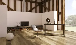 Modern living room with a fireplace, chair, and desk, featuring diverse vinyl plank layout patterns on the floor.