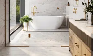 A luxurious bathroom with marble floors, a freestanding tub, and a vanity. This image shows why marble is good for bathroom floors, offering elegance and durability.