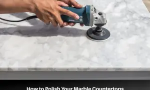 Hands using a polisher to polish a marble countertop, demonstrating how to polish marble tile for a brilliant shine.