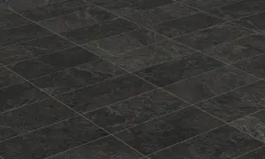 A textured, dark grey tiled floor, perfect for learning how to clean black tiles in the bathroom.