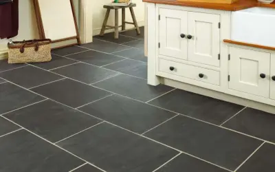 Dark slate tiles with light grout in a kitchen. Learn how to clean slate floors to keep them looking this good.