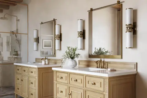 Elegant bathroom with double vanity, brass fixtures, and modern vanity light height 8 ft ceiling.