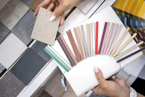Choosing the best grout for porcelain tile involves selecting the perfect color from a fan of samples.