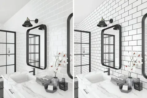 A modern bathroom features white subway tile with dark grout, a black framed mirror, and a black industrial-style light fixture.