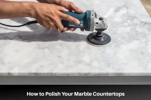 Hands using a polisher to polish a marble countertop, demonstrating how to polish marble tile for a brilliant shine.