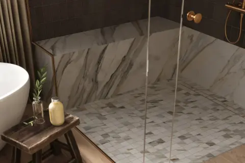 Elegant shower floor designs featuring a mosaic of small, diamond-shaped tiles in white and earth tones, complementing the marble walls.