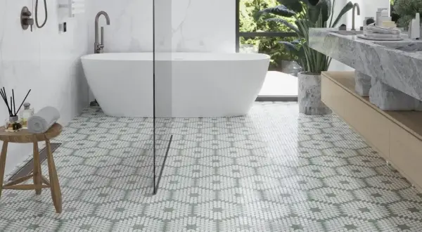 Stylish bathroom with a freestanding tub and a patterned floor. Pictures of shower floors like this one showcase a modern design.