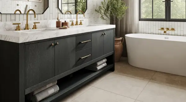 Elegant small bathroom ideas featuring a dark wood vanity with brass hardware, marble countertop, and a freestanding tub.