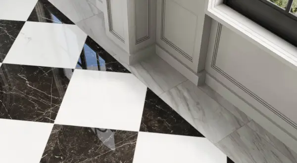A striking black and white checkerboard tile floor with marble accents. The question of what color grout for black and white checkerboard tile is answered by the subtle, almost invisible grout lines, enhancing the bold pattern.