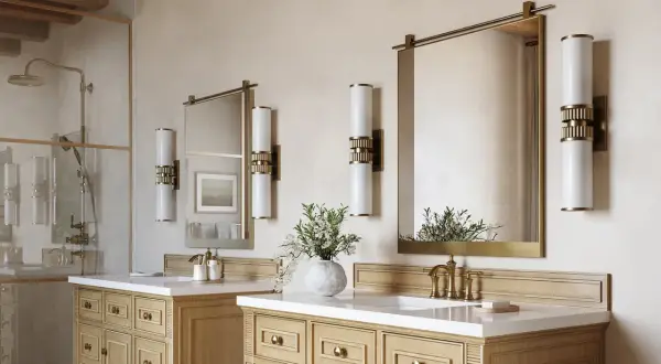 Two elegant wall sconces illuminate each side of the mirrors above the 72-inch vanity, creating a balanced and luxurious bathroom ambiance.