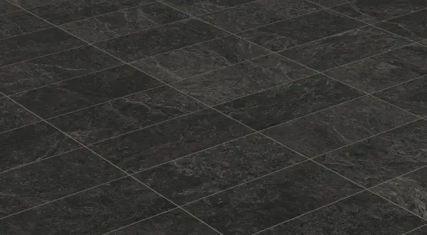 A textured, dark grey tiled floor, perfect for learning how to clean black tiles in the bathroom.