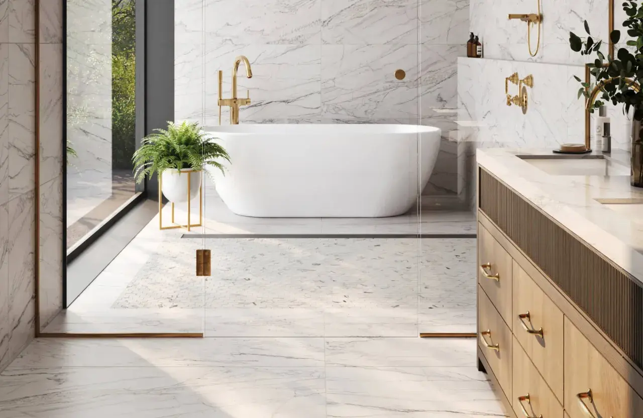 A luxurious bathroom with marble floors, a freestanding tub, and a vanity. This image shows why marble is good for bathroom floors, offering elegance and durability.