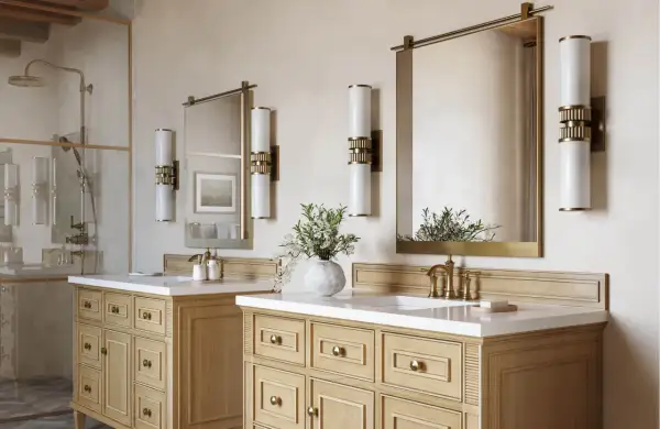 Elegant bathroom with double vanity, brass fixtures, and modern vanity light height 8 ft ceiling.