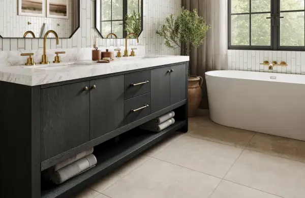 Elegant small bathroom ideas featuring a dark wood vanity with brass hardware, marble countertop, and a freestanding tub.