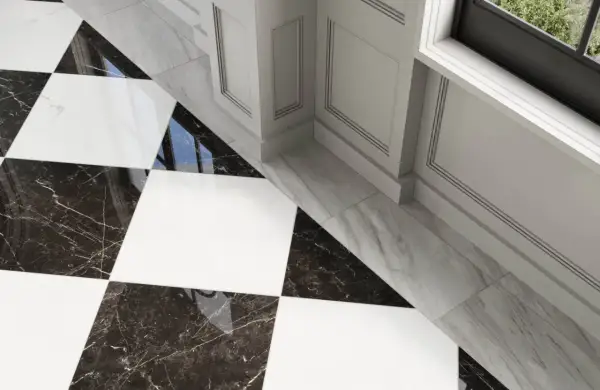 A striking black and white checkerboard tile floor with marble accents. The question of what color grout for black and white checkerboard tile is answered by the subtle, almost invisible grout lines, enhancing the bold pattern.