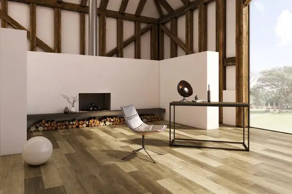 Modern living room with a fireplace, chair, and desk, featuring diverse vinyl plank layout patterns on the floor.