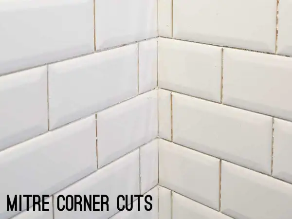 White subway tile corner with mitre cuts, showcasing clean subway tile edge options for a seamless finish.
