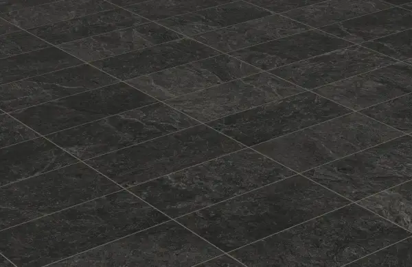 A textured, dark grey tiled floor, perfect for learning how to clean black tiles in the bathroom.